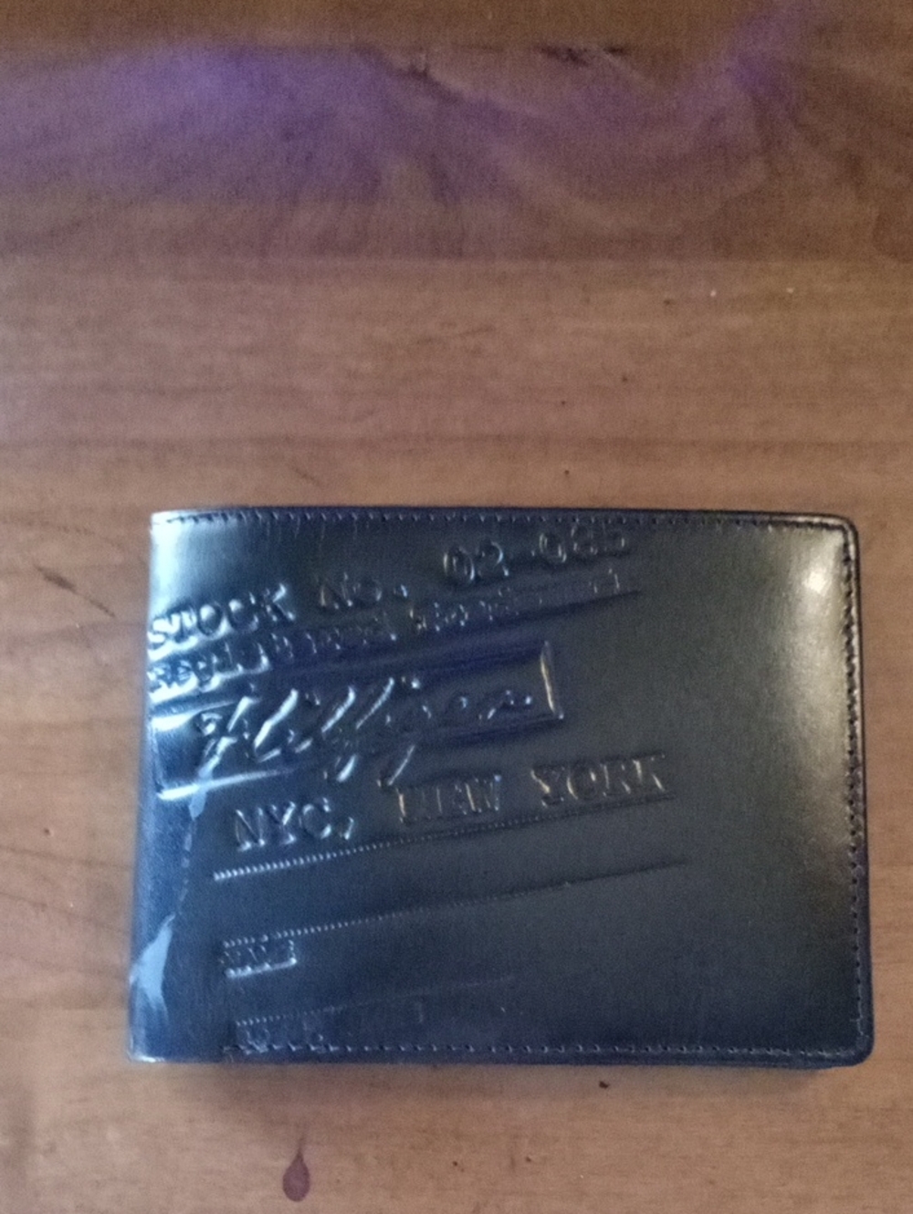Tommy Hilfiger Black Embossed Leather Bi-Fold Wallet